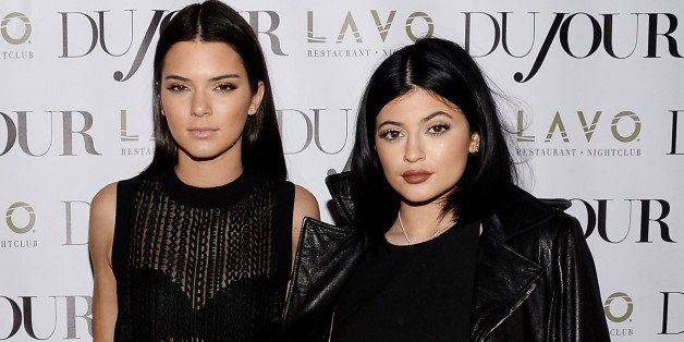 Kendall Jenner, left, and Kylie Jenner celebrate DuJour's Fall Issue at Lavo on Thursday, Aug. 28, 2014, in New York. (Photo by Evan Agostini/Invision/AP)