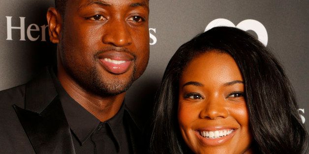 Miami Heat's Dwyane Wade and Gabrielle Union attend the "Hennessy V.S Celebrates the GQ MEN Book" at Hyde Beach at the SLS Hotel South Beach on Saturday, Oct. 12, 2013 in Miami Beach, Fl. (Photo by Omar Vega/Invision/AP)