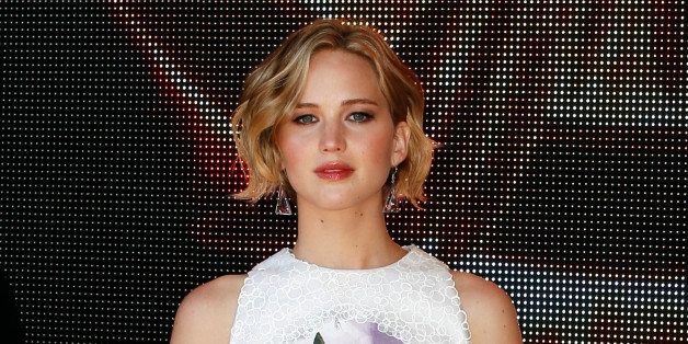 Actress Jennifer Lawrence poses for photographers during a photo call for Hunger Games: Mockingjay Part 1 at the 67th international film festival, Cannes, southern France, Saturday, May 17, 2014. (AP Photo/Alastair Grant)