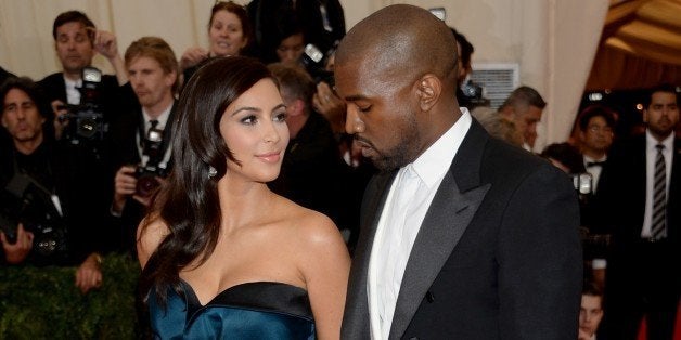 Kim Kardashian, left, and Kanye West attend The Metropolitan Museum of Art's Costume Institute benefit gala celebrating "Charles James: Beyond Fashion" on Monday, May 5, 2014, in New York. (Photo by Evan Agostini/Invision/AP)