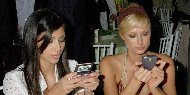 Kim Kardashian and Paris Hilton during 'Entourage' Los Angeles Premiere - Red Carpet at Cinerama Dome in Hollywood, California, United States. (Photo by Gregg DeGuire/WireImage)