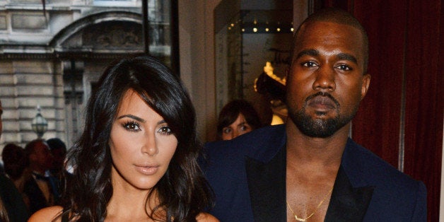 LONDON, ENGLAND - SEPTEMBER 02: Kim Kardashian (L) and Kanye West attend the GQ Men Of The Year awards in association with Hugo Boss at The Royal Opera House on September 2, 2014 in London, England. (Photo by David M. Benett/Getty Images)