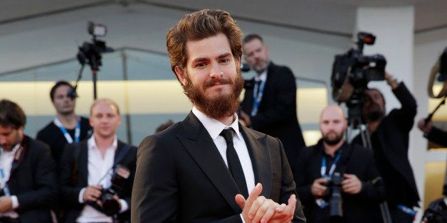Actor Andrew Garfield arrives for the premiere of the movie 99 Homes at the 71st edition of the Venice Film Festival in Venice, Italy, Friday, Aug. 29, 2014. (AP Photo/Andrew Medichini)