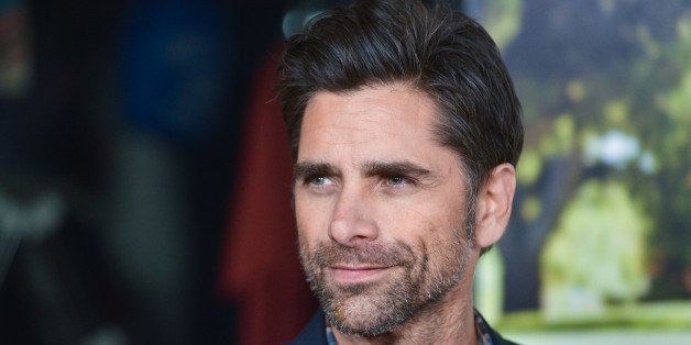 John Stamos arrives at the premiere of "Jackass Presents Bad Grandpa" at the TCL Chinese Theatre on Wednesday, Oct. 23, 2013 in Los Angeles. (Photo by Richard Shotwell/Invision/AP)