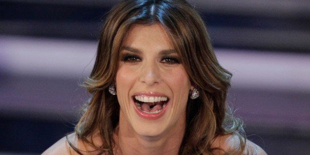 Italian showgirl Elisabetta Canalis performs during the 62nd edition of the Sanremo Song Festival, in Sanremo, Italy, Tuesday, Feb. 14, 2012. (AP Photo/Luca Bruno)