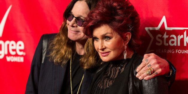 Singer Ozzy Osbourne, left, and wife Sharon Osbourne arrive at the MusiCares 2014 Person of the Year Tribute on Friday, January 24, 2014 in Los Angeles. (Photo by Paul A. Hebert/Invision/AP)