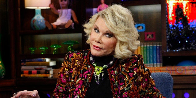 FILE - This Feb. 16, 2012 file photograph originally released by Bravo shows Joan Rivers appearng on Bravo's "Watch What Happens Live" show on in New York. Police were called to a Costco store in a Los Angeles suburb after comedian Joan Rivers handcuffed herself to a shopping cart to protest the store, which is not selling her latest book. The 79-year-old "Fashion Police" host was being filmed by a camera crew Tuesday, Aug. 7, as she complained that the store in Burbank, Calif., had refused to carry her book, "I Hate Everything... Starting With Me." Burbank city spokesman Drew Sugars says the store manager called police, who sent officers to the scene because they were uncertain of the scale of the situation. They ended up escorting Rivers from the store, and she and her crew left without incident. Sugars says there were no citations or arrests. (AP Photo/Bravo, Peter Kramer, file)