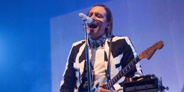 CHICAGO, IL - AUGUST 26: Win Butler of Arcade Fire performs at United Center on August 26, 2014 in Chicago, Illinois. (Photo by Gabriel Grams/Getty Images)