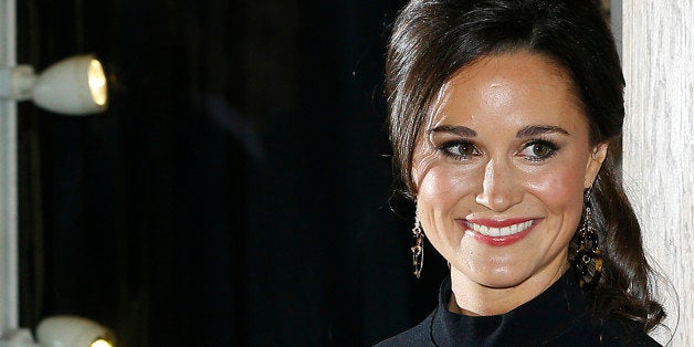 Pippa Middleton, sister to the Duchess of Cambridge, formerly known as Kate Middleton, poses for the media as she arrives at a bookshop to promote her new book "Celebrate: A Year of British festivities for families and friends", in London Thursday, Oct. 25, 2012. (AP Photo/Kirsty Wigglesworth)