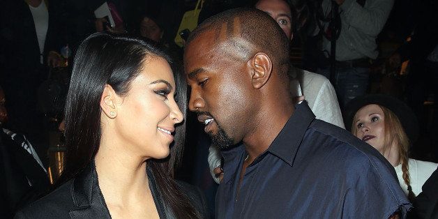PARIS, FRANCE - SEPTEMBER 25: Kim Kardashian and Kanye West attend the Lanvin show as part of the Paris Fashion Week Womenswear Spring/Summer 2015 on September 25, 2014 in Paris, France. (Photo by Rindoff/Dufour/Getty Images)