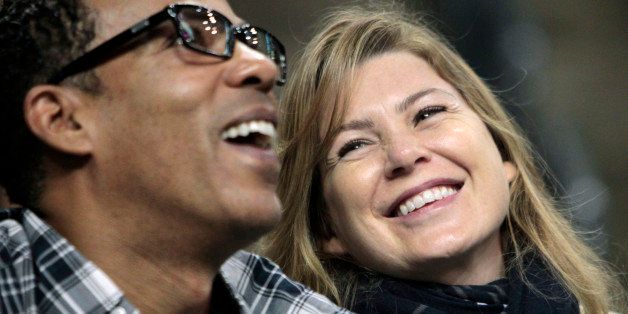 Actress Ellen Pompeo, right, and her husband, Chris Ivery, watch Game 5 of the NBA basketball finals between the Boston Celtics and the Los Angeles Lakers Sunday, June 13, 2010, in Boston. (AP Photo/Michael Dwyer)
