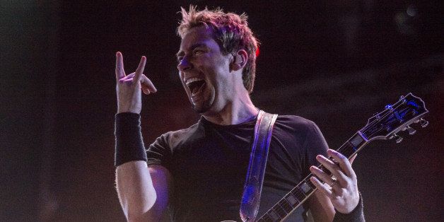 Chad Kroger of Canadian rock band Nickelback performs during the Rock in Rio music festival in Rio de Janeiro, Brazil, on September 20, 2013. AFP PHOTO / YASUYOSHI CHIBA (Photo credit should read YASUYOSHI CHIBA/AFP/Getty Images)