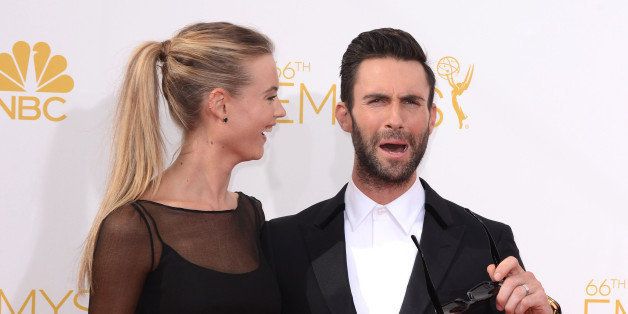 LOS ANGELES, CA - AUGUST 25: Model Behati Prinsloo and singer Adam Levine of Maroon 5 arrive to the 66th Annual Primetime Emmy Awards at Nokia Theatre L.A. Live on August 25, 2014 in Los Angeles, California. (Photo by C Flanigan/Getty Images)
