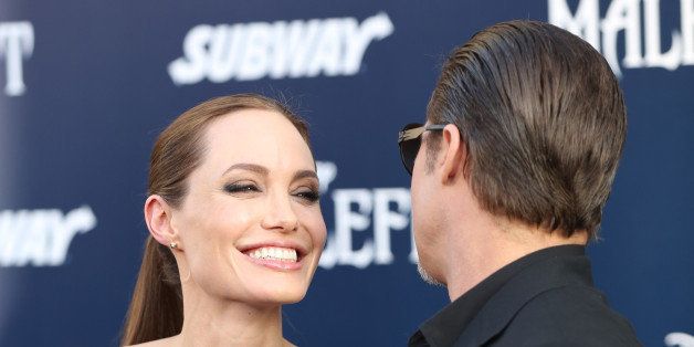 Angelina Jolie and Brad Pitt arrive at the world premiere of "Maleficent" at the El Capitan Theatre on Wednesday, May 28, 2014, in Los Angeles. (Photo by Matt Sayles/Invision/AP)