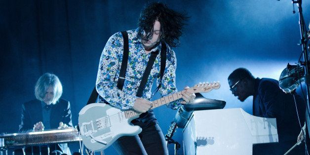 Jack White (C) and Isaiah Owens (R) perform at The Governors Ball Music Festival at Randall's Island Park on Saturday, June 7, 2014 in New York. (Photo by Scott Roth/Invision/AP)