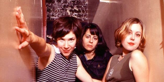 Portrait of Sleater-Kinney (L-R) Carrie Brownstein, Janet Weiss, Corin Tucker, backstage at The Fillmore in San Francisco, California, USA on 23rd September 2002. (Photo by Anthony Pidgeon/Redferns)