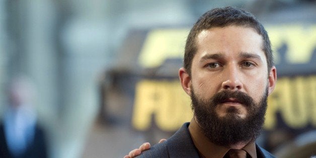 US actor Shia LaBeouf poses during a photocall for the film 'Fury', on October 18, 2014 in Paris. AFP PHOTO / MARTIN BUREAU