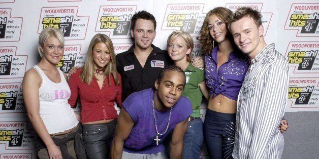 LONDON - DECEMBER 9: British pop group S Club 7 at the Smash Hits Poll Winners party in London on December 9, 2001. The group are (Back L to R) Jo, Rachel, Paul, Hannah, Tina, Jon and (Front C) Bradley. They won Record of the Year for 'Don't Stop Movin' and performed at the party which was broadcast live on the TV show T4. (Photo by John Rogers/Getty Images)