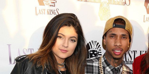 LOS ANGELES, CA - FEBRUARY 20: (L-R) Television personality Kylie Jenner, rapper Tyga, and television personality Kendall Jenner attend the exclusive press preview of Tyga's new store, Last Kings Flagship Store, on February 20, 2014 in Los Angeles, California. (Photo by Imeh Akpanudosen/Getty Images)