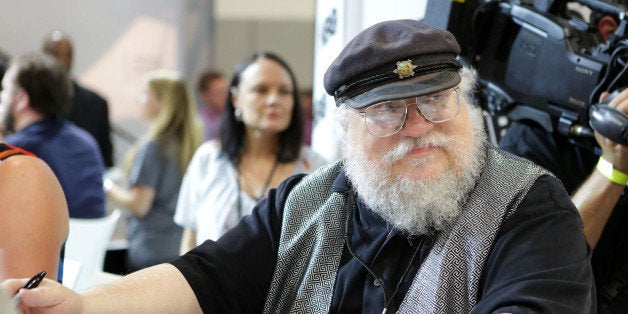 SAN DIEGO, CA - JULY 25: Writer George R.R. Martin of 'Game of Thrones' signs autographs during the 2014 Comic-Con International Convention-Day 3 at the San Diego Convention Center on July 25, 2014 in San Diego, California. (Photo by Tiffany Rose/Getty Images)