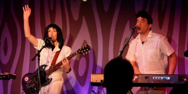 This undated image released by IFC shows Carrie Brownstein, left, and Fred Armisen as "Gil & Merrill" in a scene from "Po