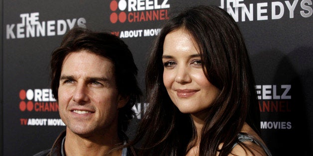 Cast member Katie Holmes, right, and Tom Cruise arrive at the premiere of "The Kennedys" at The Academy of Motion Pictures Arts and Sciences in Beverly Hills, Calif. on Monday, March 28, 2011. "The Kennedys", an 8-part mini-series, will premiere on ReelzChannel on April 3 . (AP Photo/Matt Sayles)