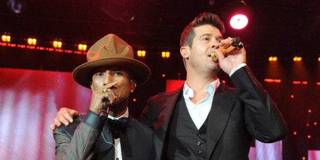 LOS ANGELES, CA - JANUARY 25: Pharrell Williams and Robin Thicke perform onstage during the 56th annual GRAMMY Awards Pre-G