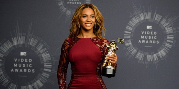 Beyonce poses with her Video Vanguard Award in the press room at the MTV Video Music Awards at The Forum on Sunday, Aug. 24,