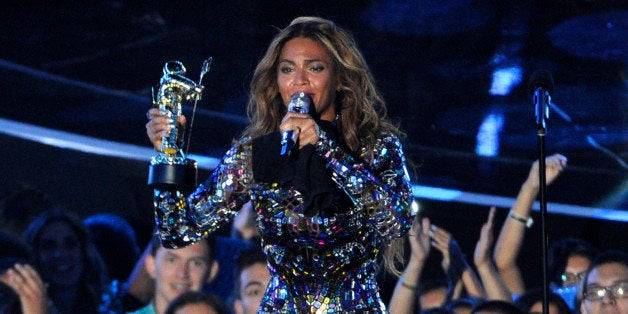 Beyonce accepts the Video Vanguard Award on stage at the MTV Video Music Awards at The Forum on Sunday, Aug. 24, 2014, in Ing
