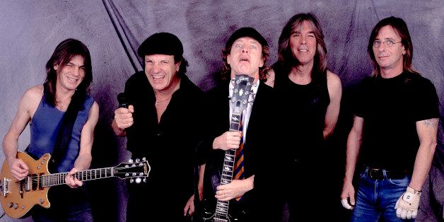 Portrait of Australian rock group AC/DC backstage at the United Arena, Chicago, Illinois, April 8, 2001. Pictured are, from left, Malcolm Young, Brian Johnson, Angus Young, Cliff Williams, and Phil Rudd. (Photo by Paul Natkin/Getty Images)
