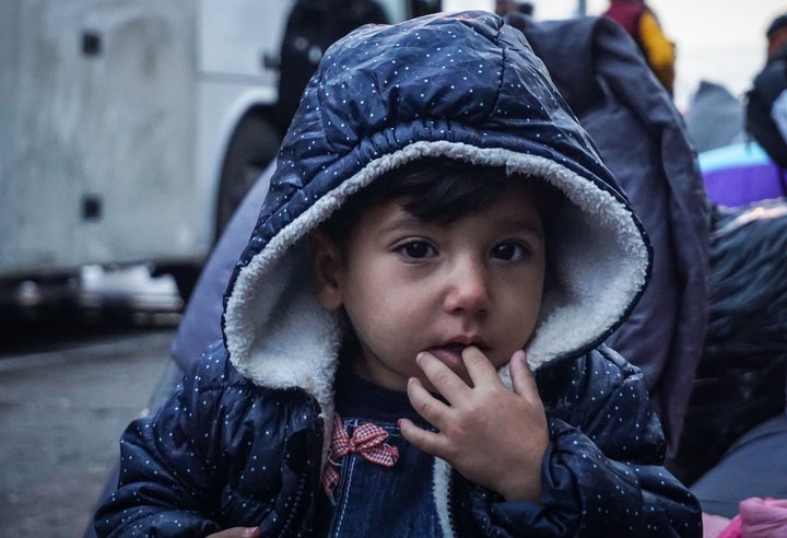 A Syrian boy at the Port of Piraeus in Greece where thousands of migrants and refugees were set to arrive from Lesbos in September