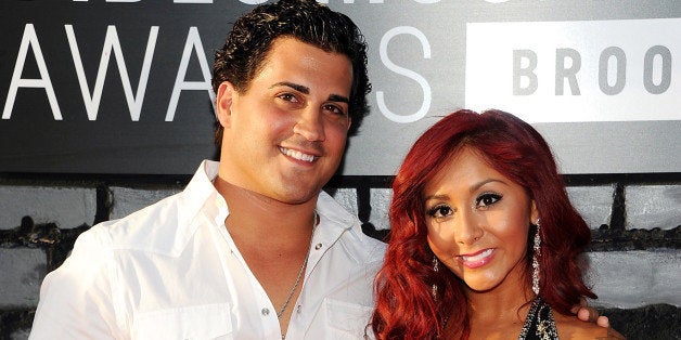 CORRECTS BABY WEIGHT - FILE - In this Aug. 25, 2013 file photo, Nicole "Snooki" Polizzi, right, and Jionni LaValle arrive at the MTV Video Music Awards in the Brooklyn borough of New York. The former âJersey Shoreâ cast member has given birth to a baby girl, her publicist, Stacey Wechsler, confirmed Friday, Sept. 26, 2014. Giovanna Marie Lavalle weighs 6lbs, 7 oz. She and fiance, Jionni LaValle, 27, already have a two-year-old son, Lorenzo. (Photo by Evan Agostini/Invision/AP, File)