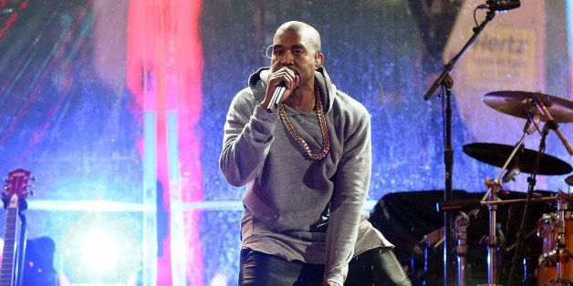 NEW YORK, NY - DECEMBER 01: Kanye West performs at the surprise World AIDS Day (RED) Concert in Times Square on December 1, 2014 in New York City. (Photo by Taylor Hill/FilmMagic)