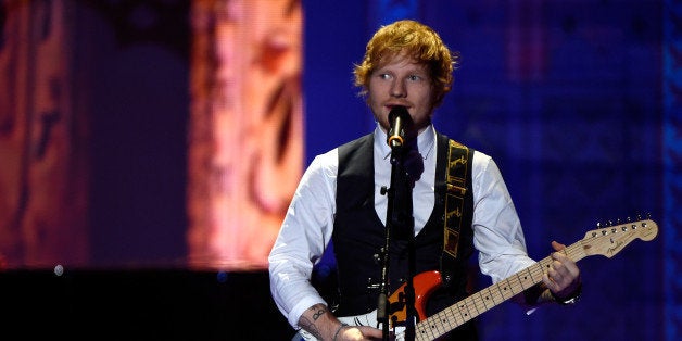 LONDON, ENGLAND - DECEMBER 02: Ed Sheeran performs on the runway at the annual Victoria's Secret fashion show at Earls Court on December 2, 2014 in London, England. (Photo by Pascal Le Segretain/Getty Images)