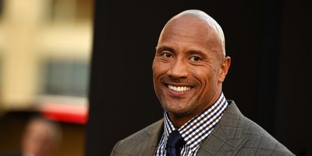 Actor Dwayne Johnson attends the premiere of 'Hercules,' July 23, 2014 at TCL Chinese Theatre in Hollywood, California. AFP PHOTO / Robyn Beck (Photo credit should read ROBYN BECK/AFP/Getty Images)