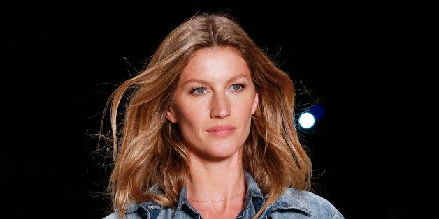 Brazilian model Gisele Bundchen wears a creation the from Colcci Winter collection during the Sao Paulo Fashion Week in Sao Paulo, Brazil, Tuesday, Nov. 4, 2014. (AP Photo/Andre Penner)