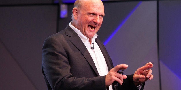 Steve Ballmer, the outgoing chief executive officer of Microsoft Corp., gestures as he speaks during a news conference in the