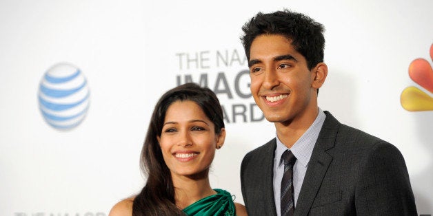 Freida Pinto, left, and Dev Patel arrive at the 44th Annual NAACP Image Awards at the Shrine Auditorium in Los Angeles on Friday, Feb. 1, 2013. (Photo by Chris Pizzello/Invision/AP)