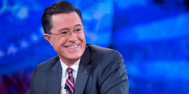 Television personality Stephen Colbert smiles while taping the 'The Colbert Report' with U.S. President Barack Obama, not pic