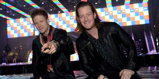 NASHVILLE, TN - DECEMBER 12: Brian Kelley and Tyler Hubbard of Florida Georgia Line pose for a photo during a press conference for the American Country Countdown Awards on December 12, 2014 in Nashville, Tennessee. (Photo by Rick Diamond/Getty Images for dcp)