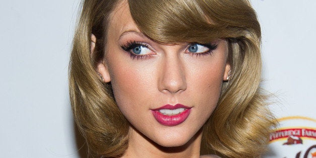 Taylor Swift poses in the Z100 Jingle Ball press room at Madison Square Garden on Friday, Dec. 12, 2014, in New York. (Photo by Charles Sykes/Invision/AP)