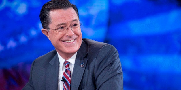 Television personality Stephen Colbert smiles while taping the 'The Colbert Report' with U.S. President Barack Obama, not pic