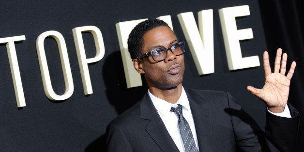Actor/director Chris Rock attends the premiere of "Top Five" at the Ziegfeld Theatre on Wednesday, Dec. 3, 2014, in New York.