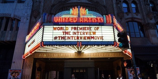 Security is seen outside The Theatre at Ace Hotel before the premiere of the film 'The Interview' in Los Angeles, California on December 11, 2014. The film, starring US actors Seth Rogen and James Franco, is a comedy about a CIA plot to assassinate its leader Kim Jong-Un, played by Randall Park. North Korea has vowed 'merciless retaliation' against what it calls a 'wanton act of terror' -- although it has denied involvement in a massive cyber attack on Sony Pictures, the studio behind the film. AFP PHOTO/STR (Photo credit should read -/AFP/Getty Images)