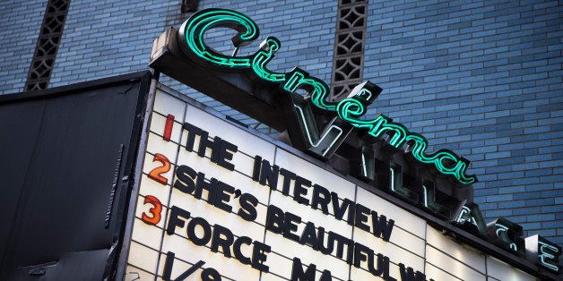 "The Interview" is listed on the Cinema Village movie theater marquee, Thursday, Dec. 25, 2014, in New York. The film's Christmas Day release was canceled by Sony after threats of violence by hackers linked to North Korea, but the release was reinstated in some independent theaters and through a variety of digital platforms. (AP Photo/John Minchillo)