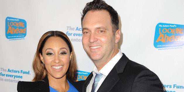 HOLLYWOOD, CA - DECEMBER 04: Actress Tamera Mowry and journalist Adam Housley arrive at The Actor's Fund 2014 The Looking Ah