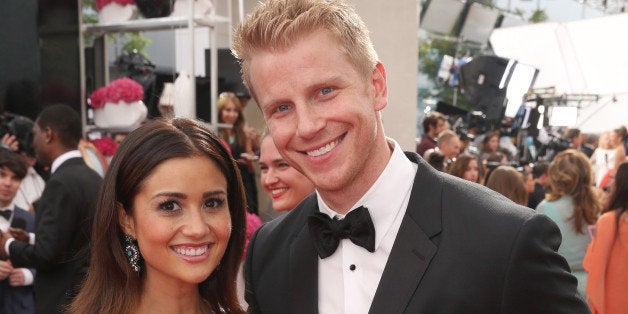 Catherine Giudici, left, and Sean Lowe arrive at the 66th Primetime Emmy Awards at the Nokia Theatre L.A. Live on Monday, Aug. 25, 2014, in Los Angeles. (Photo by Matt Sayles/Invision for the Television Academy/AP Images)