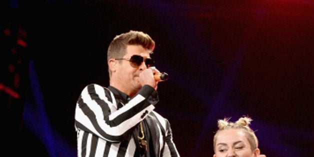 NEW YORK, NY - AUGUST 25: Robin Thicke and Miley Cyrus perform during the 2013 MTV Video Music Awards at the Barclays Center