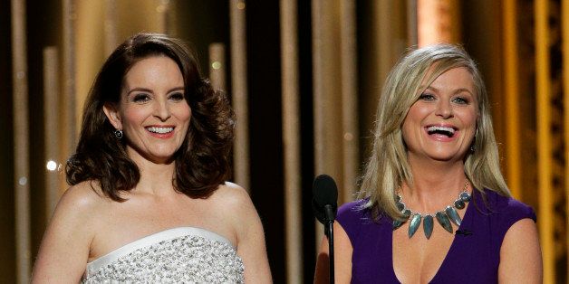 BEVERLY HILLS, CA - JANUARY 11: In this handout photo provided by NBCUniversal, Hosts Tina Fey and Amy Poehler speak onstage during the 72nd Annual Golden Globe Awards at The Beverly Hilton Hotel on January 11, 2015 in Beverly Hills, California. (Photo by Paul Drinkwater/NBCUniversal via Getty Images)