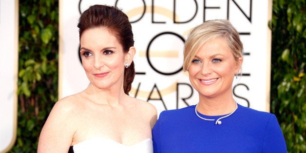 BEVERLY HILLS, CA - JANUARY 11: Hosts Tina Fey (L) and Amy Poehler attend the 72nd Annual Golden Globe Awards at The Beverly Hilton Hotel on January 11, 2015 in Beverly Hills, California. (Photo by Jeff Vespa/WireImage)